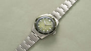 Orologio subacqueo ORIS in acciaio, quadrante verde sfumato, lunetta diver, bracciale maglie