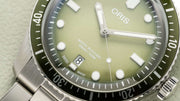 Quadrante verde sfumato dell’orologio ORIS con indici e lancette luminescenti