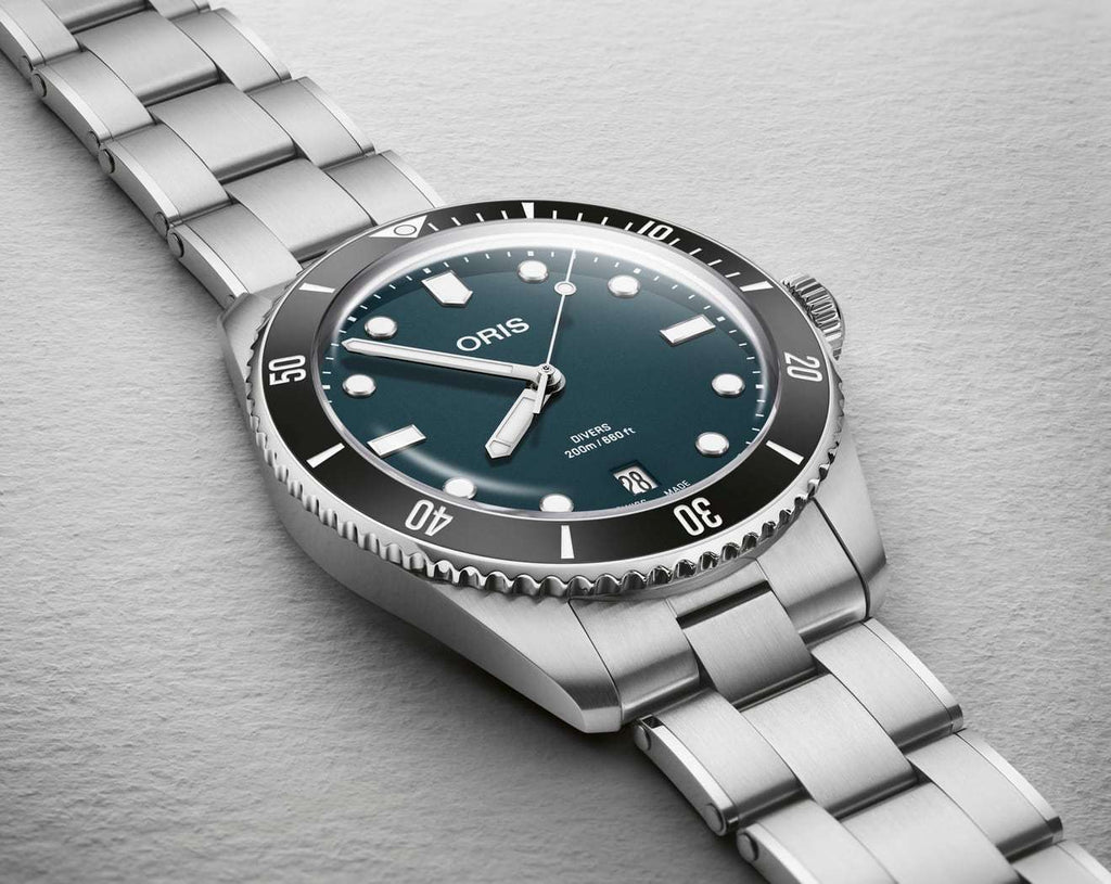 Oris Divers Date Uomo 39mm Acciaio Quadrante Blu Automatico Calibro 733-1 Lunetta Ceramica Vetro Zaffiro Bracciale Acciaio Cinturino Gomma Data Super-LumiNova 200m Swiss Made Ref. 01 733 7795 4055-Set Oasi Watch