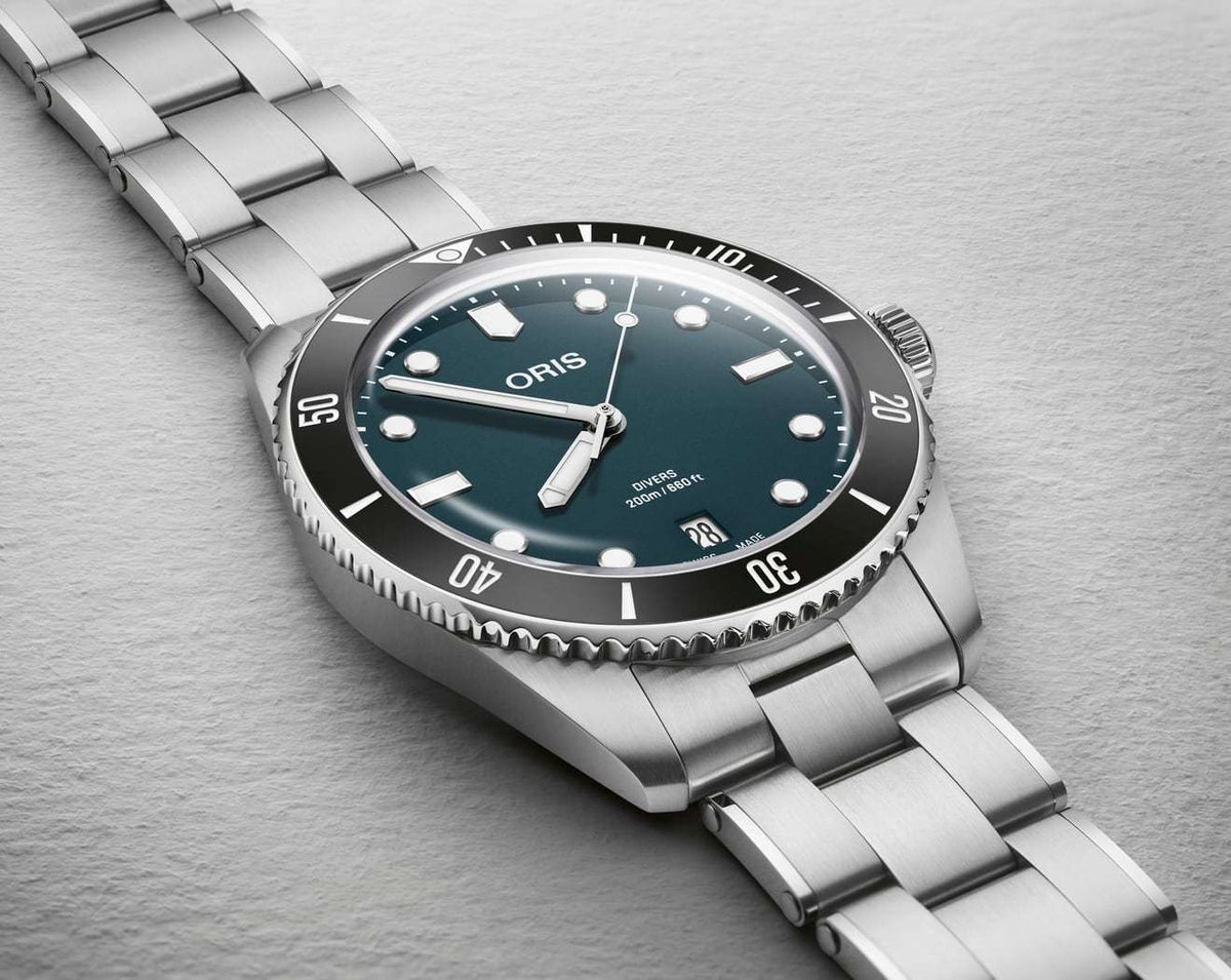 Oris Divers Date Uomo 39mm Acciaio Quadrante Blu Automatico Calibro 733-1 Lunetta Ceramica Vetro Zaffiro Bracciale Acciaio Cinturino Gomma Data Super-LumiNova 200m Swiss Made Ref. 01 733 7795 4055-Set Oasi Watch
