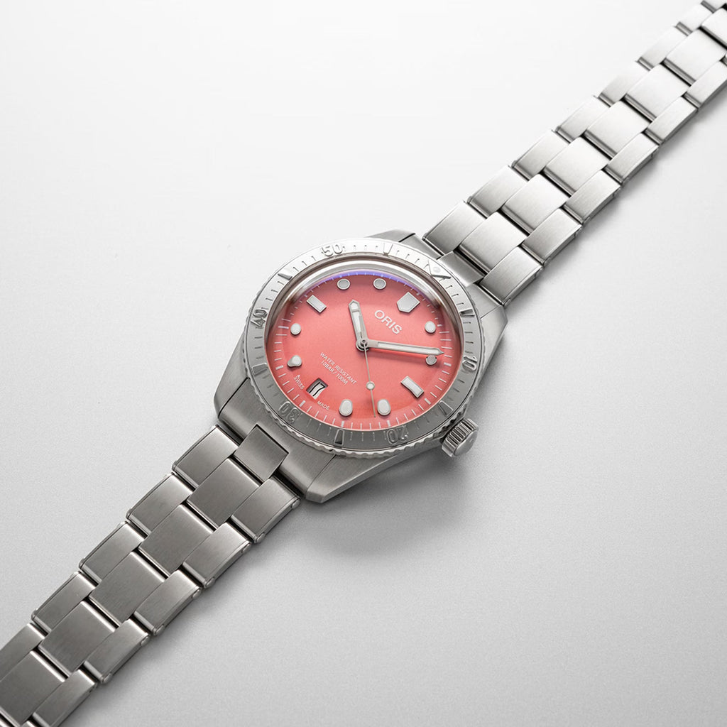 Orologio Oris subacqueo con bracciale in acciaio e quadrante rosa, cassa tonda