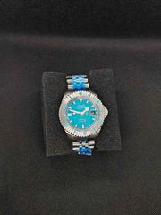 Orologio subacqueo con quadrante blu-verde, ghiera dentata e bracciale in acciaio