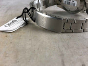Orologio ORIS con bracciale in acciaio e fondello; tag e cinturino a maglie metalliche.