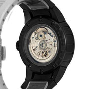 Orologio vista fondello: meccanismo argentato sotto vetro, cassa nera in acciaio