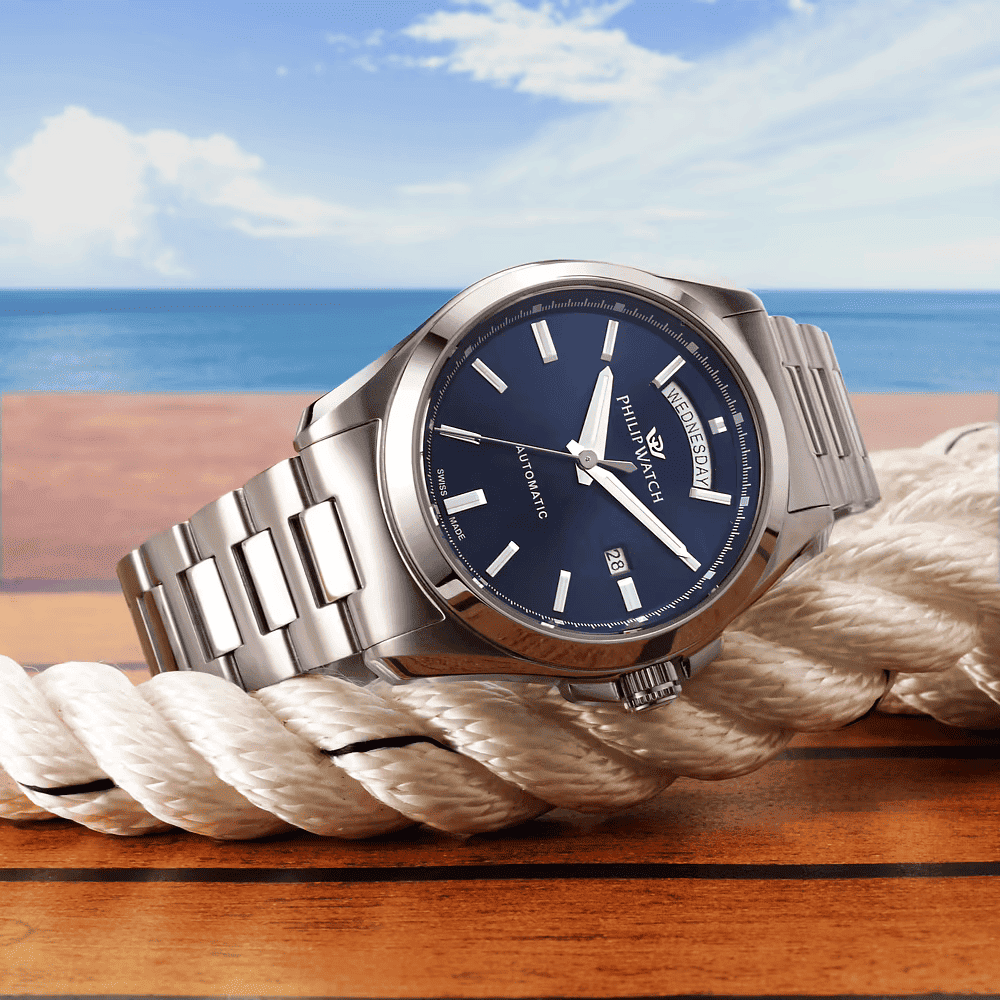 Orologio automatico in acciaio con quadrante blu e bracciale a maglie, finestra data