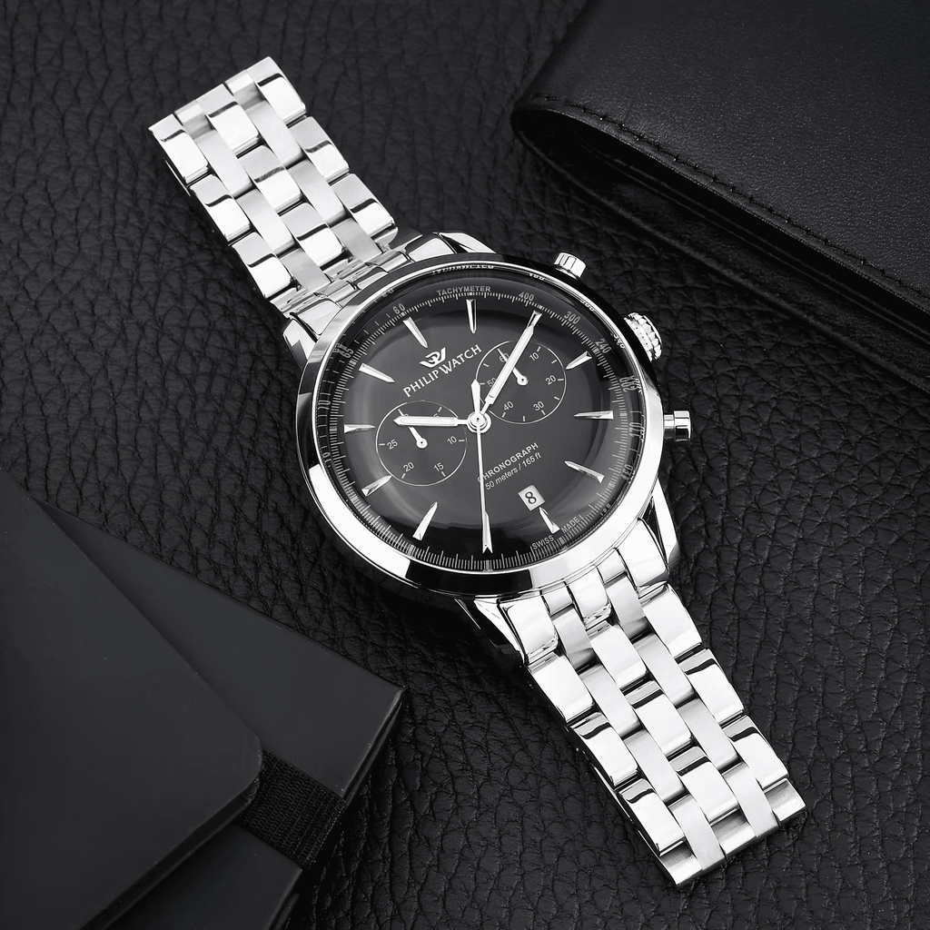 Orologio cronografo con quadrante nero e cinturino in maglie d’acciaio