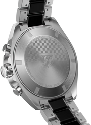 Orologio con fondello inciso, motivo a scacchi e scritta TAG Heuer