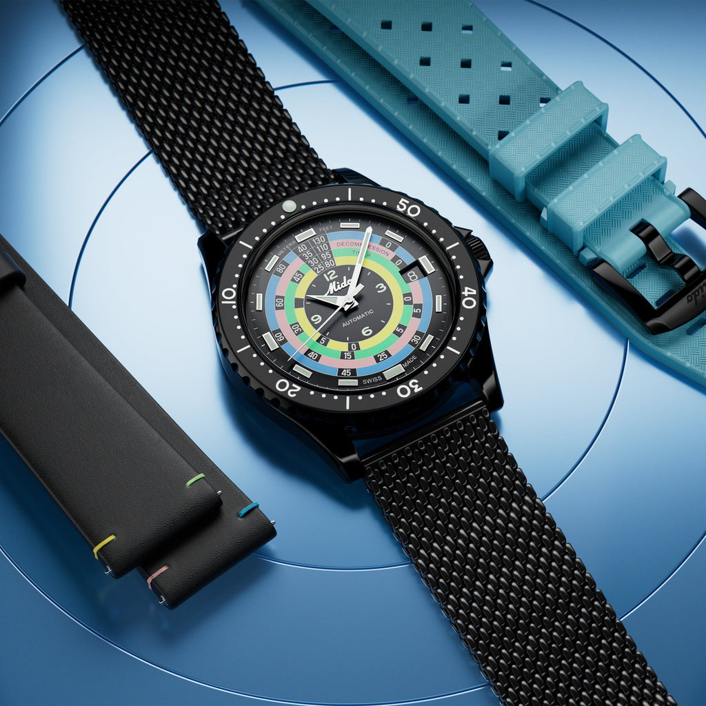 Orologio sul polso con cinturino in maglia nera e quadrante multiscala