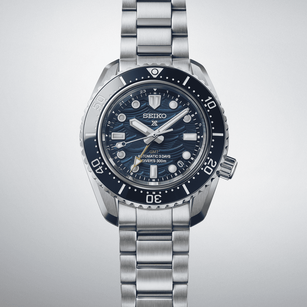 Orologio sub GMT con quadrante blu, indici luminosi, bracciale in metallo e corona