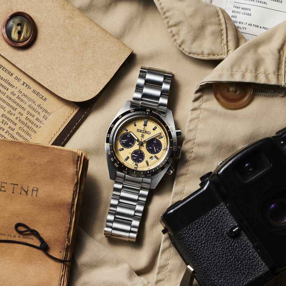 Orologio cronografo con quadrante giallo oro e bracciale a maglie in acciaio
