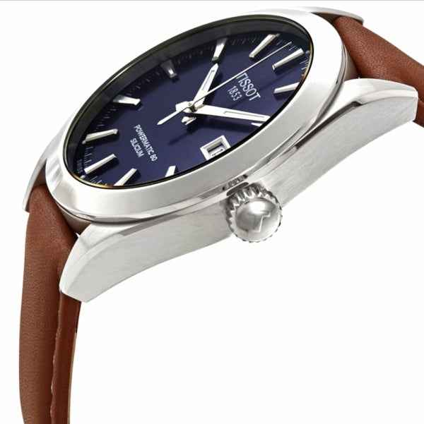 Orologio Tissot con quadrante blu e indici a bastone, cinturino in pelle marrone