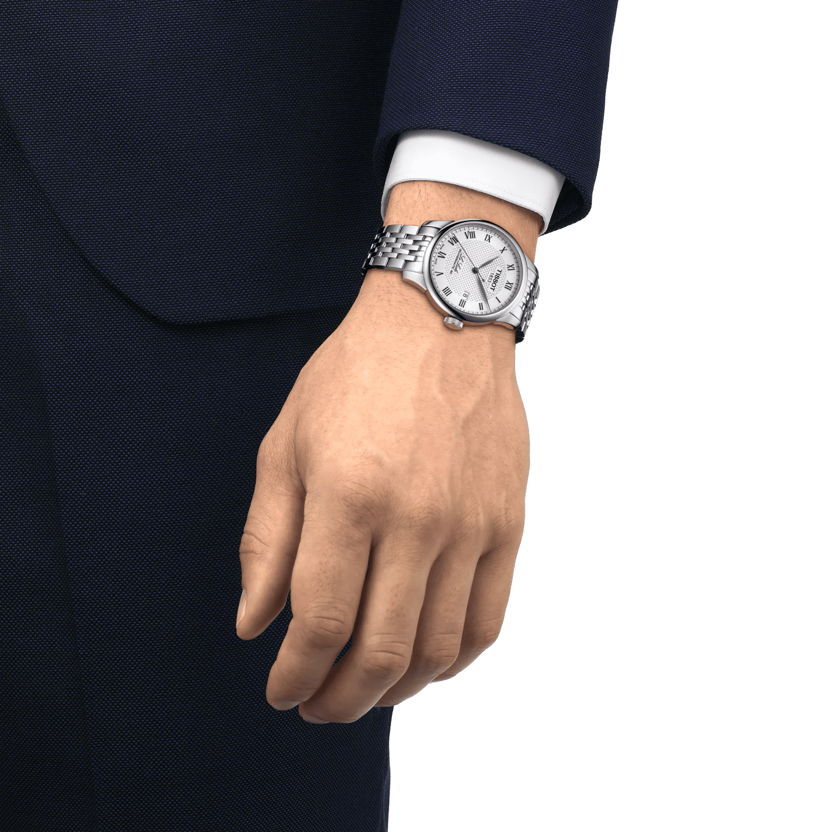 Orologio Tissot al polso con bracciale in acciaio e quadrante chiaro, su manica scura