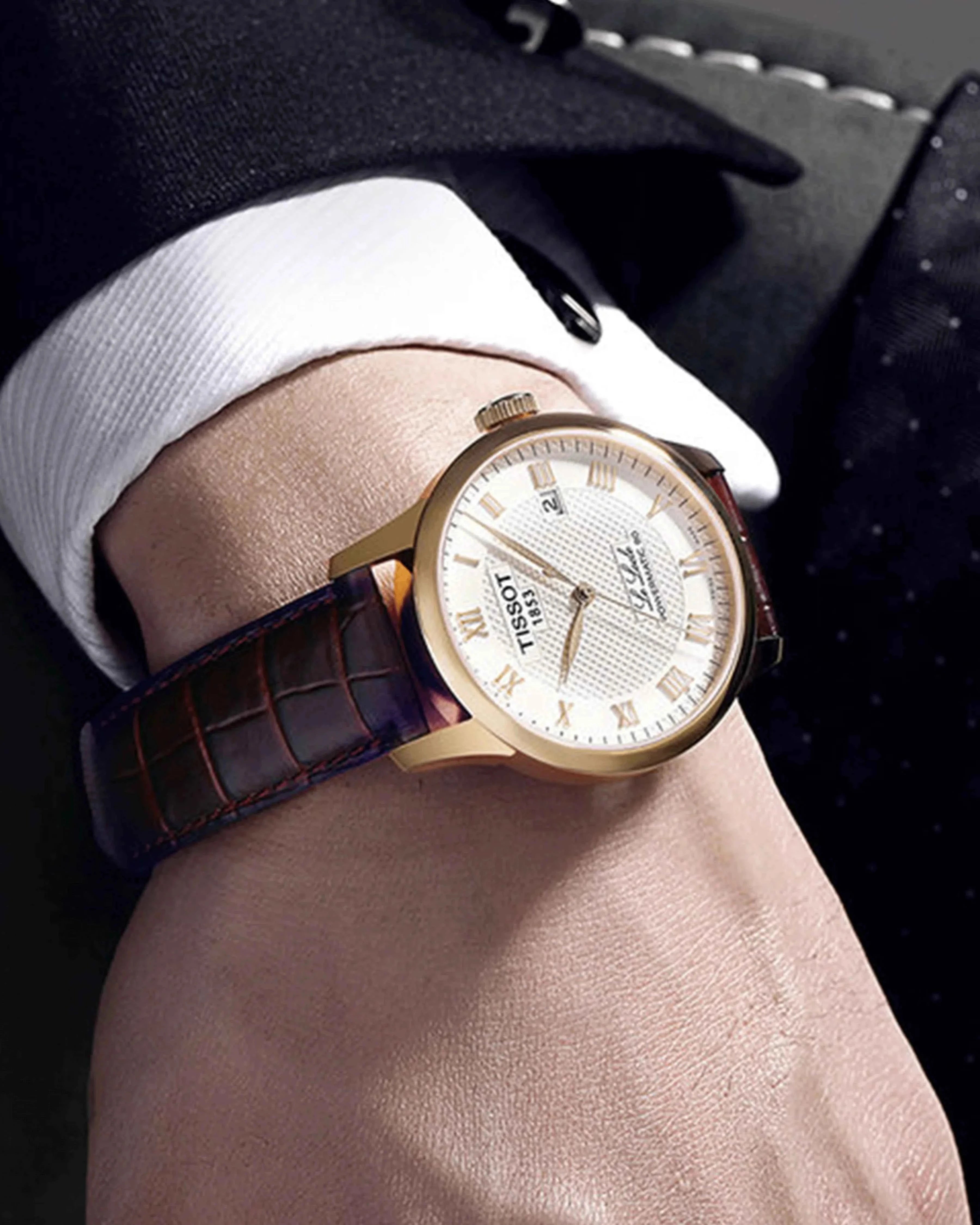 Orologio automatico con quadrante argento, indici romani e cinturino in pelle marrone