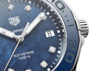 Orologio con quadrante blu, indici in diamanti, data 8 e numeri lunetta azzurri