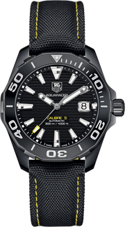 TAG Heuer Aquaracer orologio sub nero, quadrante soleil, lunetta girevole, cinturino nylon giallo