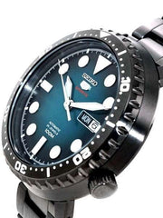 Orologio Seiko nero, quadrante turchese, lunetta subacquea, giorno-data MON