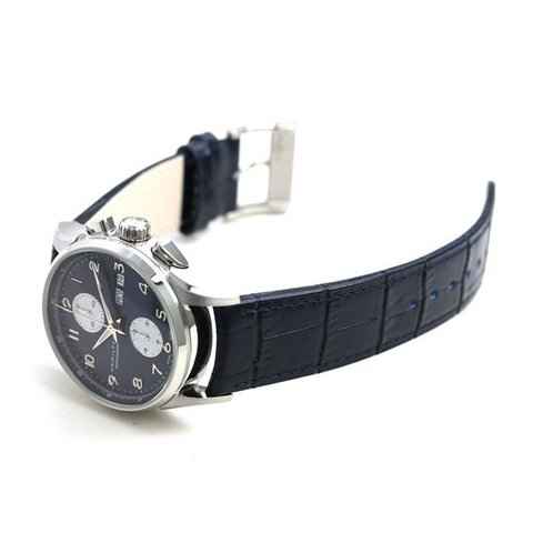 Orologio con cassa in acciaio e cinturino in pelle blu scuro, lato con pulsanti
