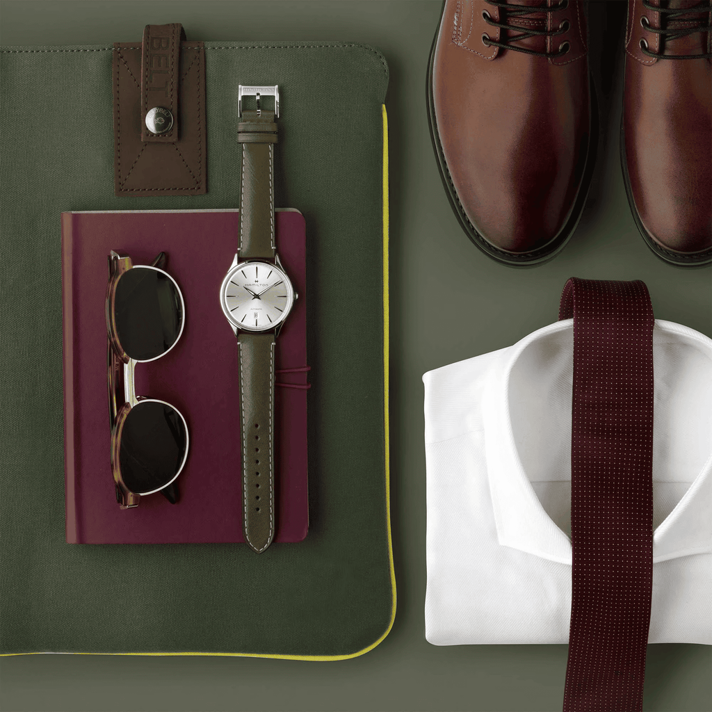 Orologio Hamilton con quadrante avorio e cinturino in pelle verde oliva, fibbia.