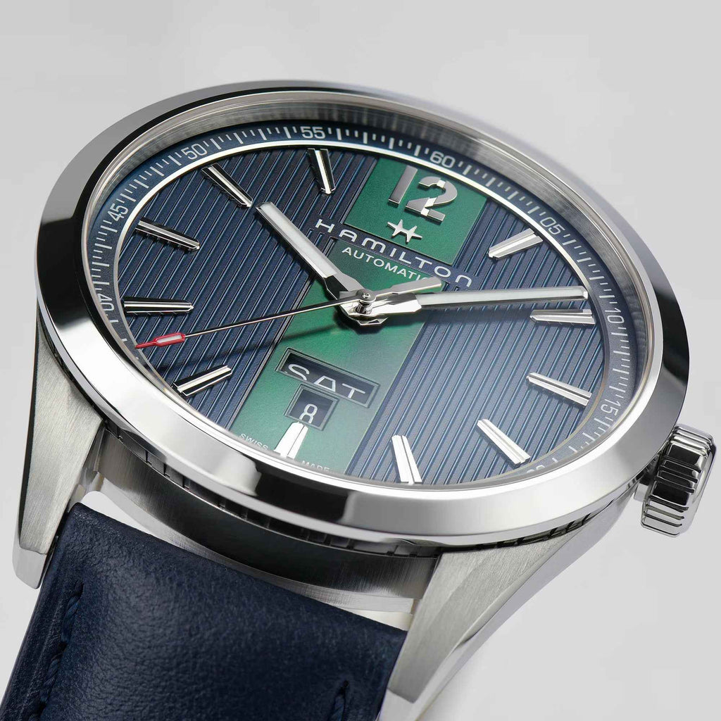 Orologio automatico con quadrante blu a righe e finestra data, cinturino in pelle blu