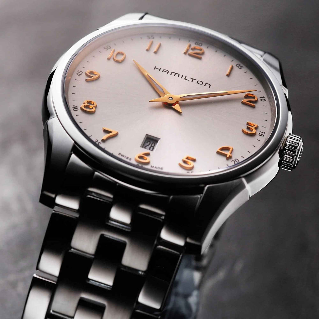Orologio Hamilton, quadrante bianco con numeri arancioni e datario visibile