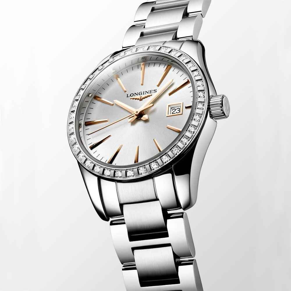 Orologio Longines Conquest con lunetta diamanti e datario, quadrante bianco, acciaio lucido