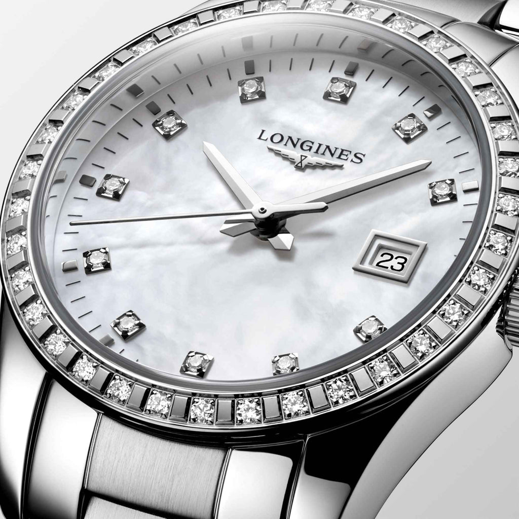 Orologio Longines Conquest Classic: quadrante madreperla, diamanti sulla lunetta e datario 23