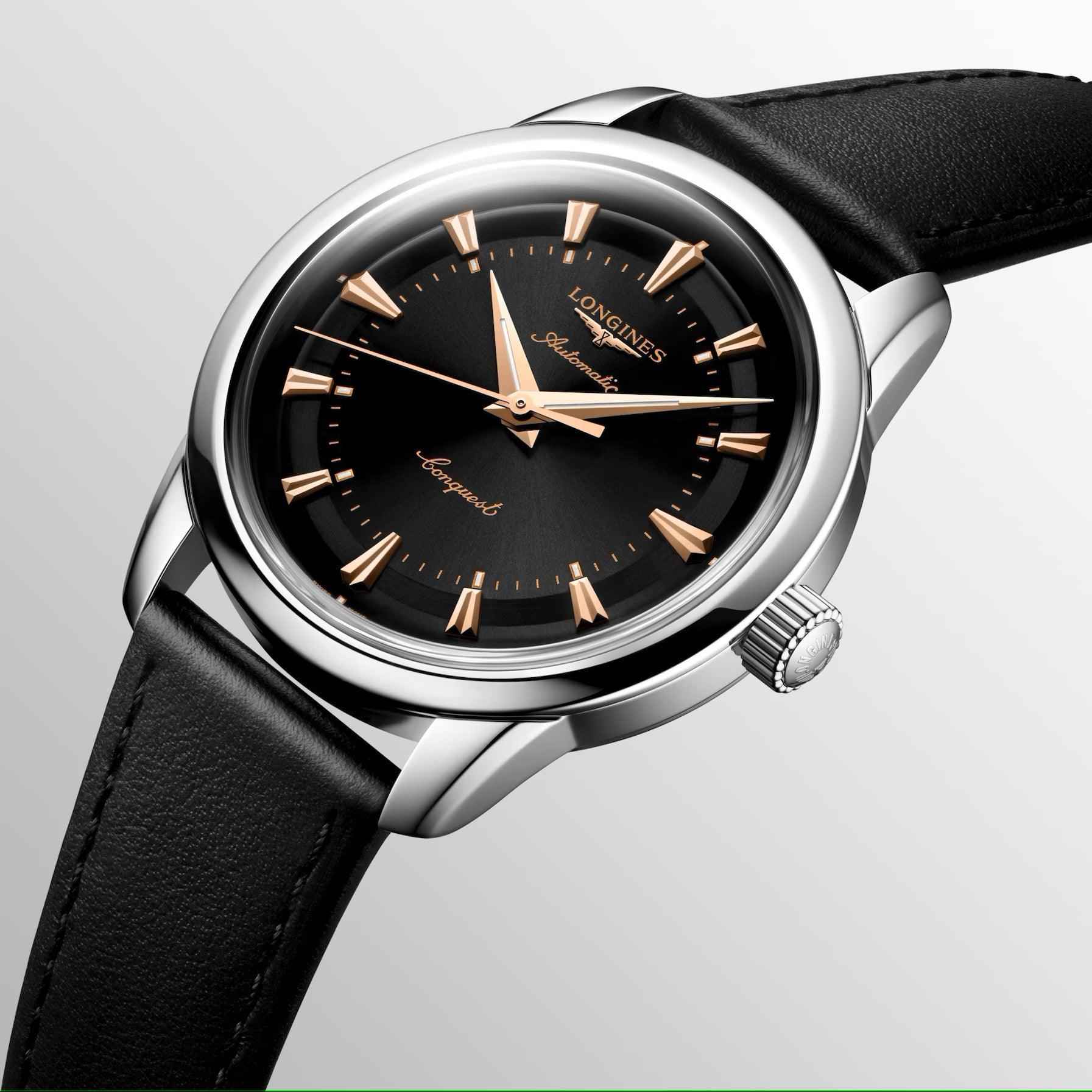 Orologio Conquest: quadrante nero con indici dorati, cassa d’acciaio e cinturino nero