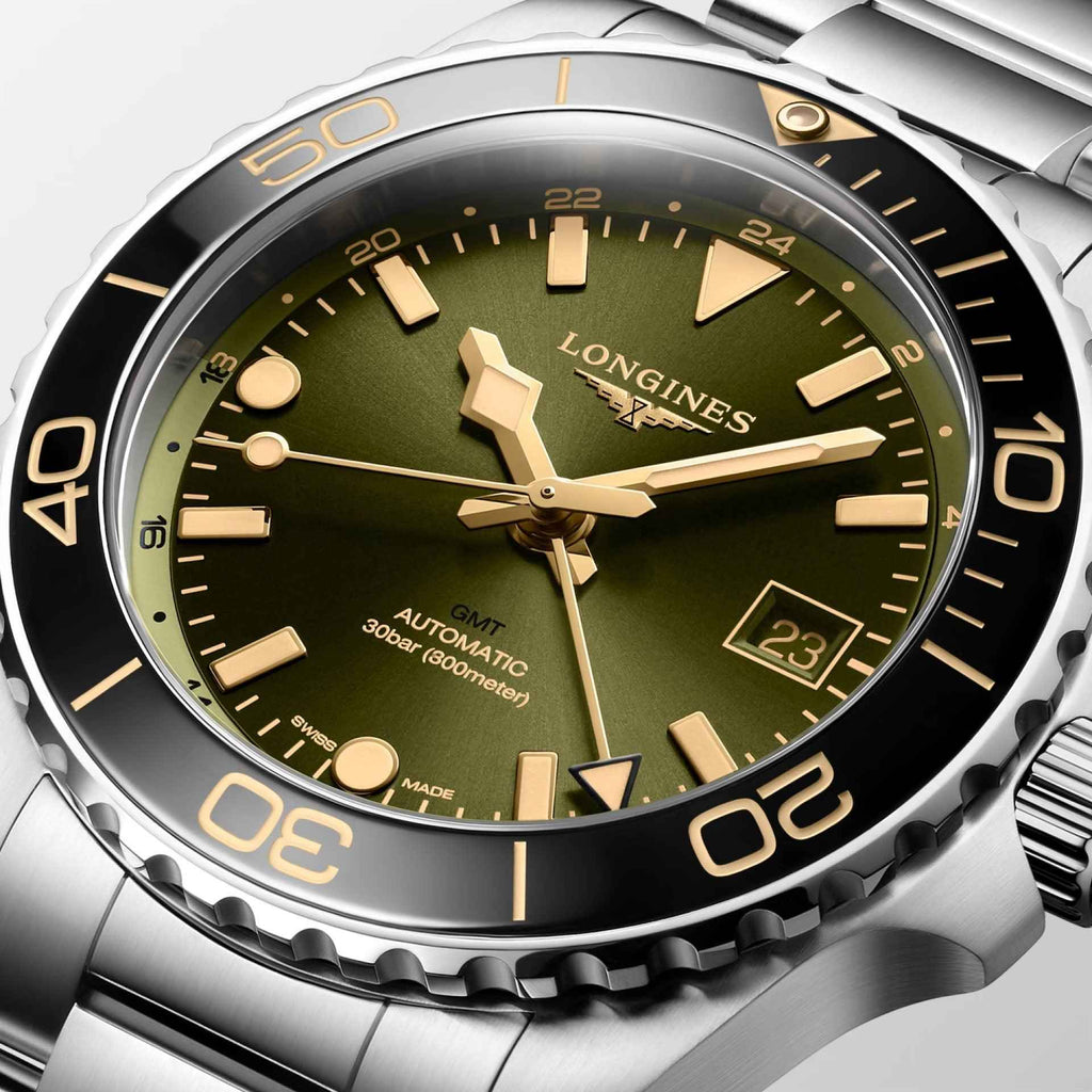 Orologio Hydroconquest GMT, quadrante verde con indici dorati e datario