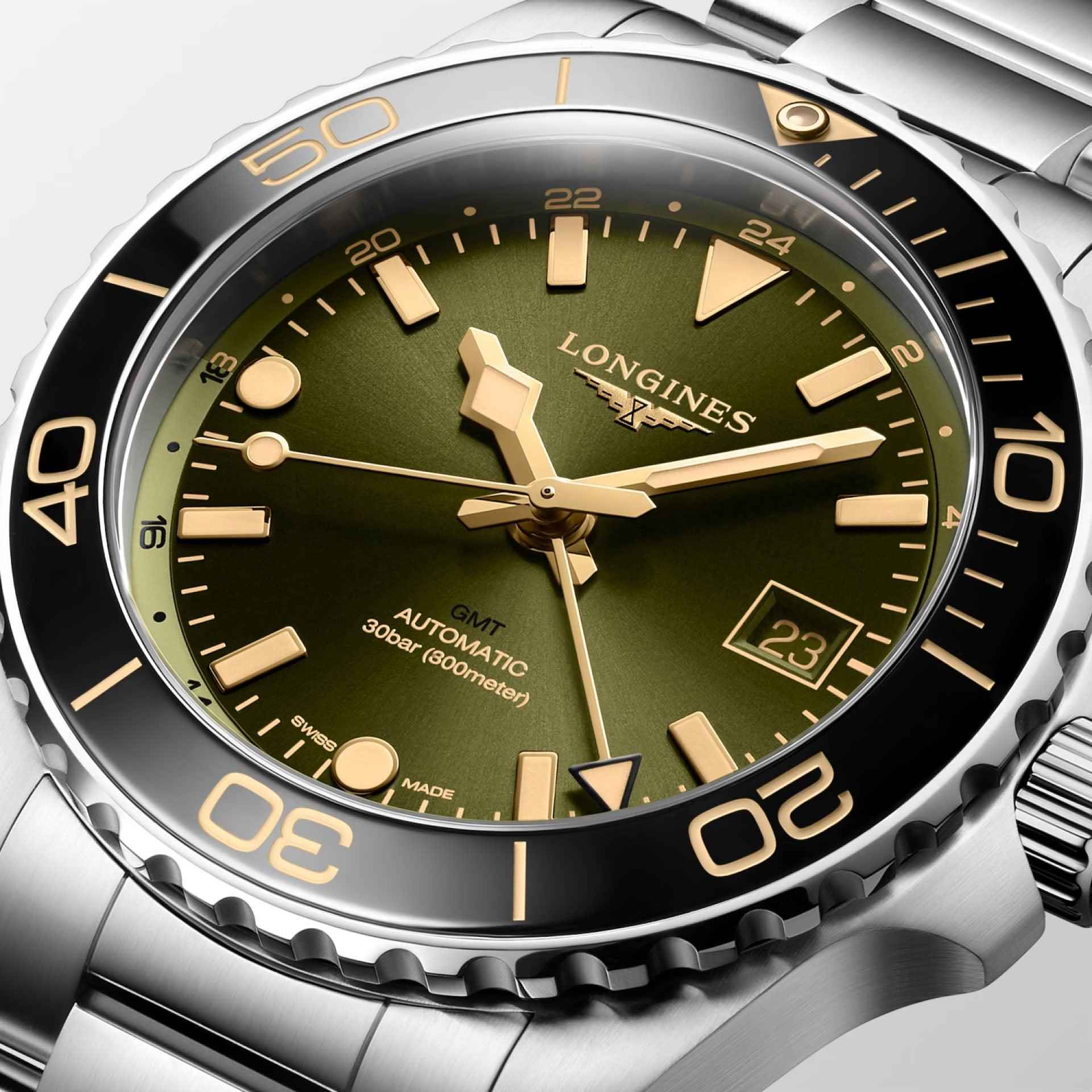 Orologio Hydroconquest GMT, quadrante verde con indici dorati e datario