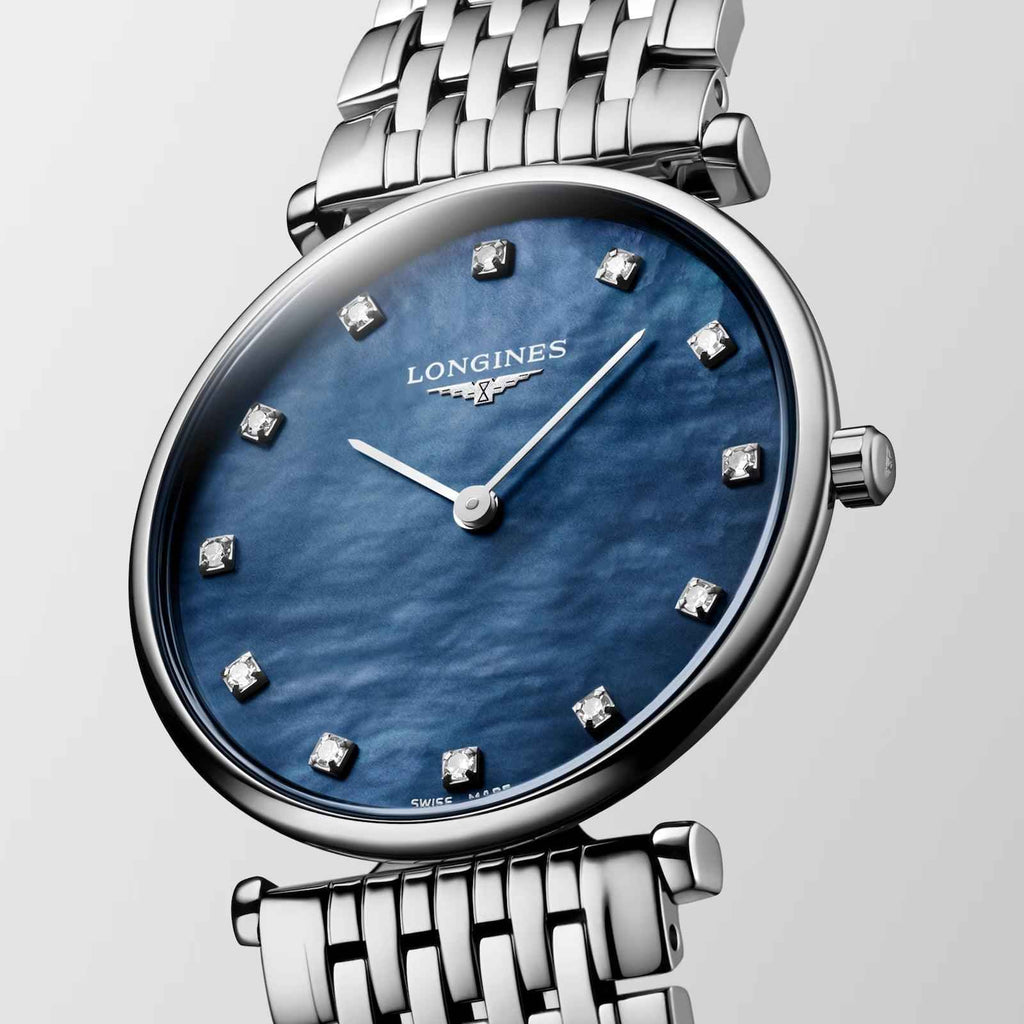 Orologio con quadrante blu a venature e indici a diamanti, cassa e bracciale in acciaio.