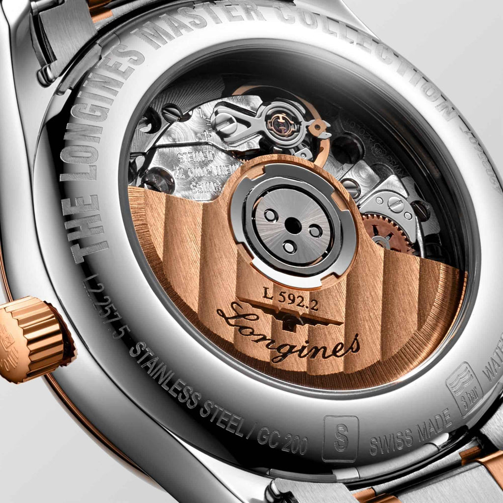 Fondello dell’orologio Longines: movimento automatico con dettagli oro rosa su acciaio
