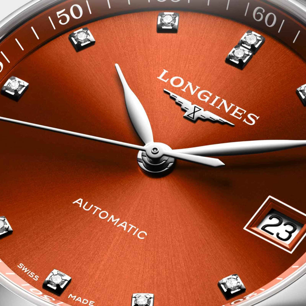 Quadrante arancione Longines con diamanti, lancette automatico