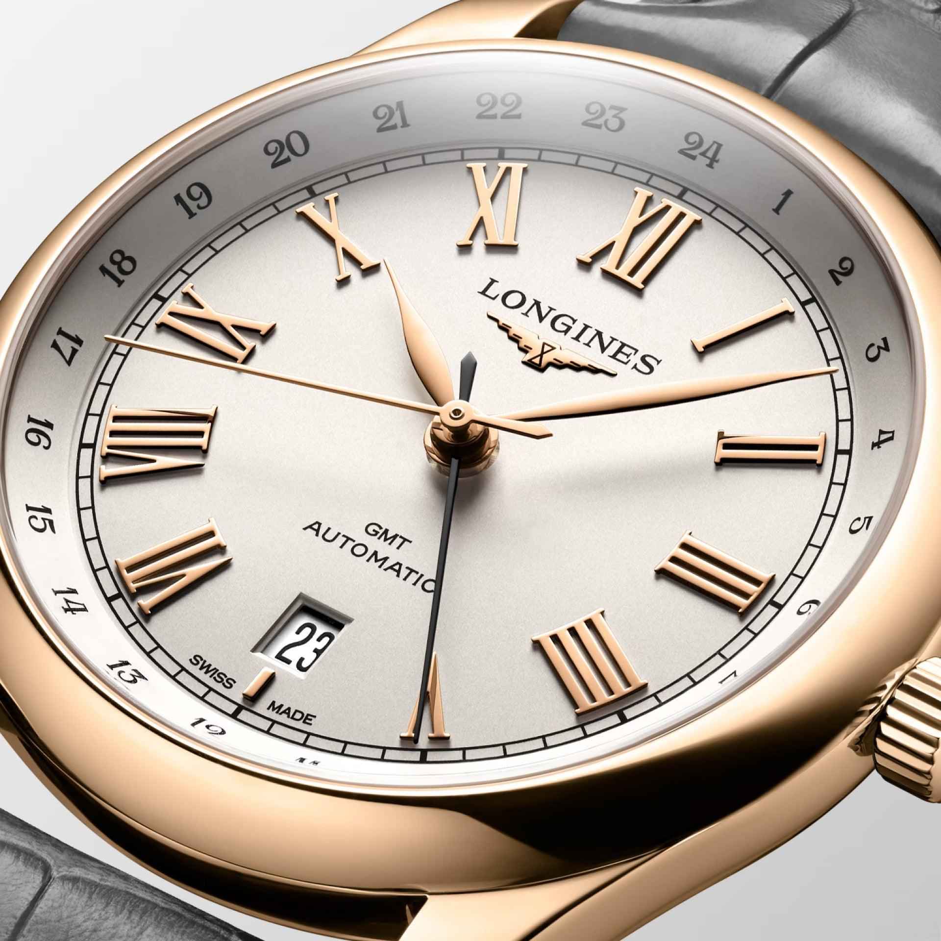 Orologio Longines GMT: quadrante bianco, indici romani dorati e datario 23