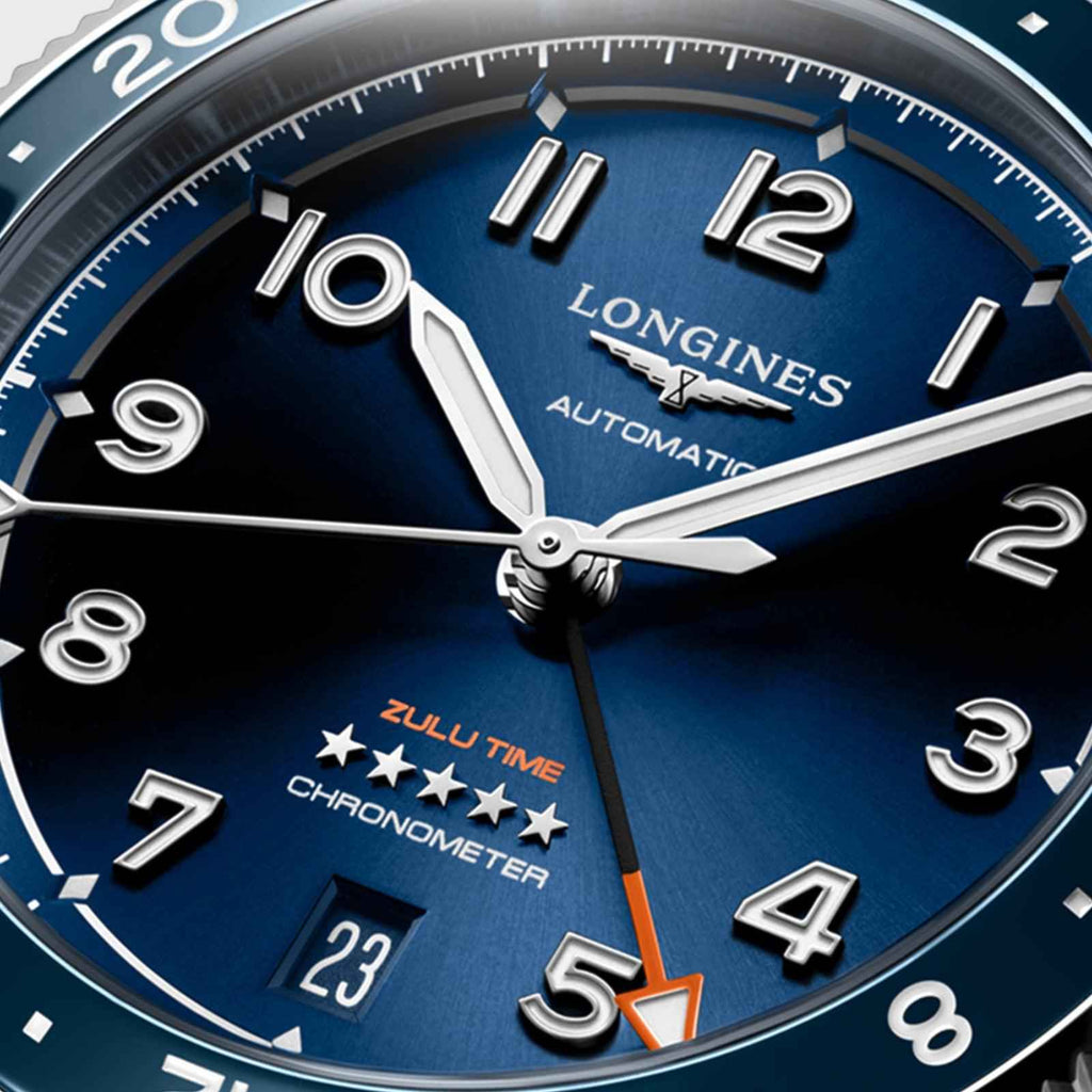 Quadrante blu con indici argentati, scritta Longines Automatic e Zulu Time