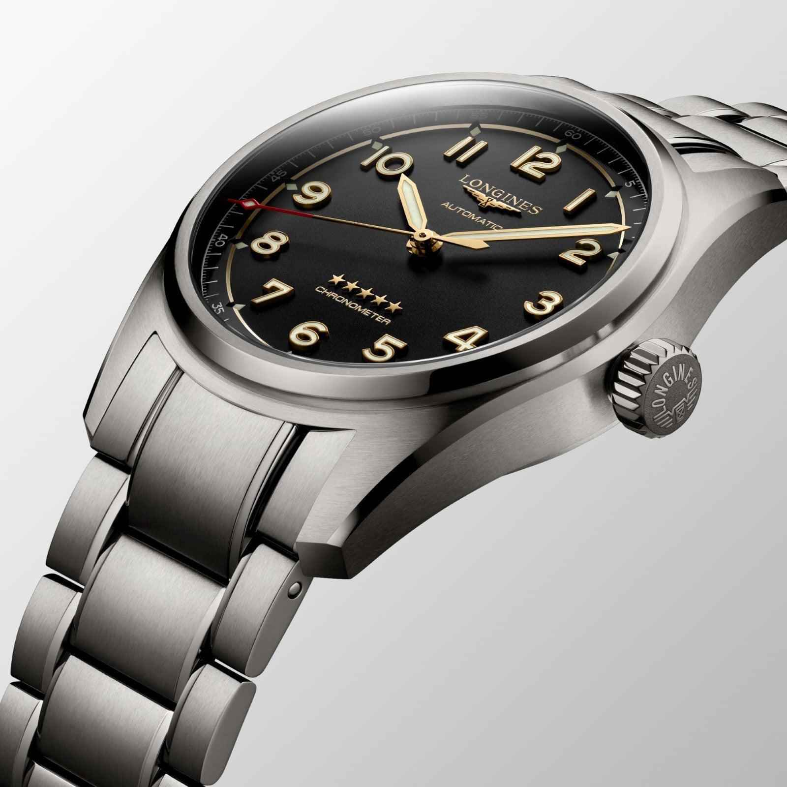 Orologio Spirit 40 mm con corona laterale e quadrante nero, indici dorati