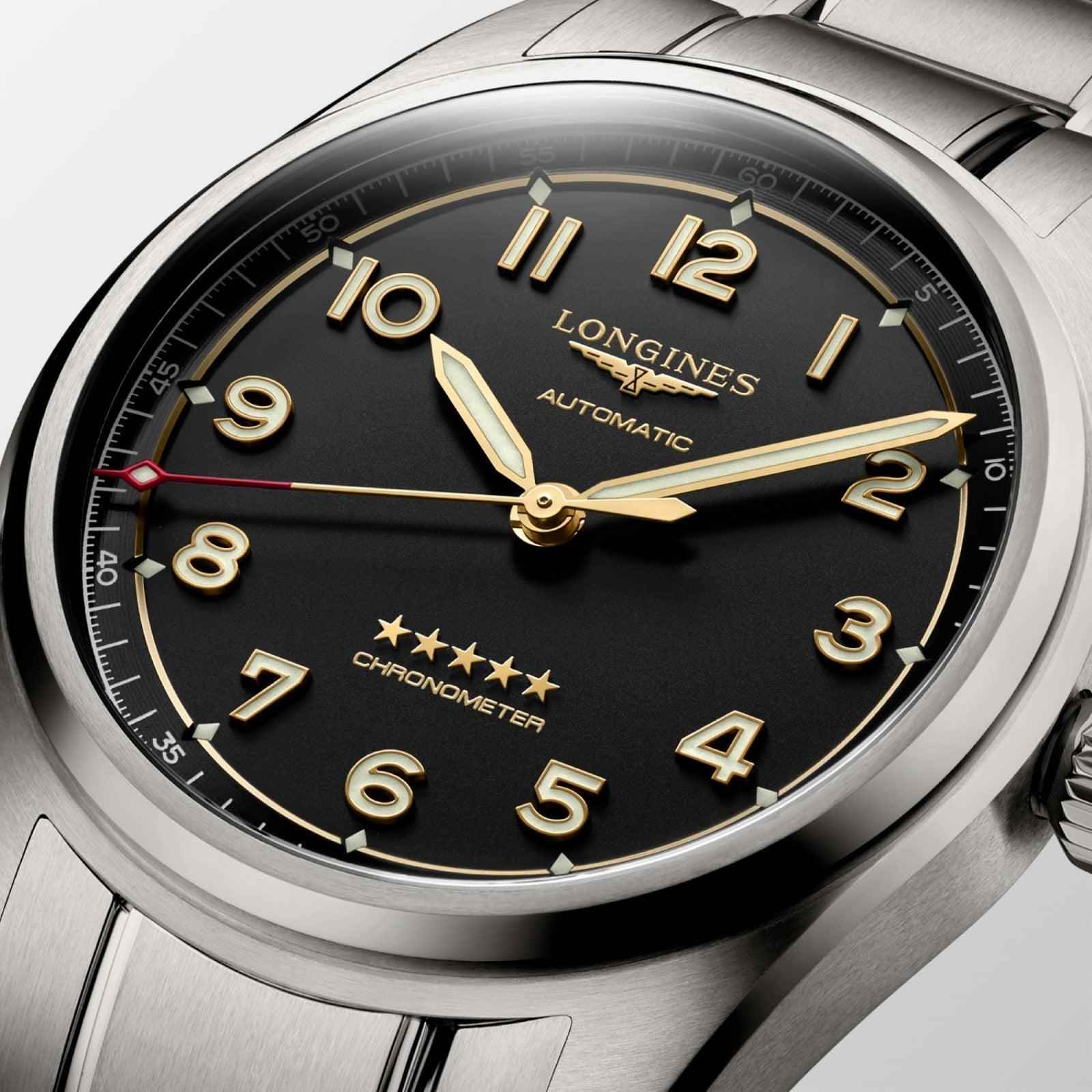 Orologio Spirit 40 mm: quadrante nero con lancette dorate e numeri arabi