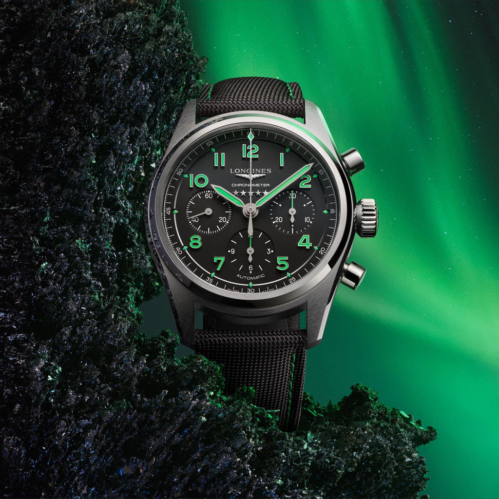 Orologio automatico nero con quadrante verde e cinturino in maglia tessile