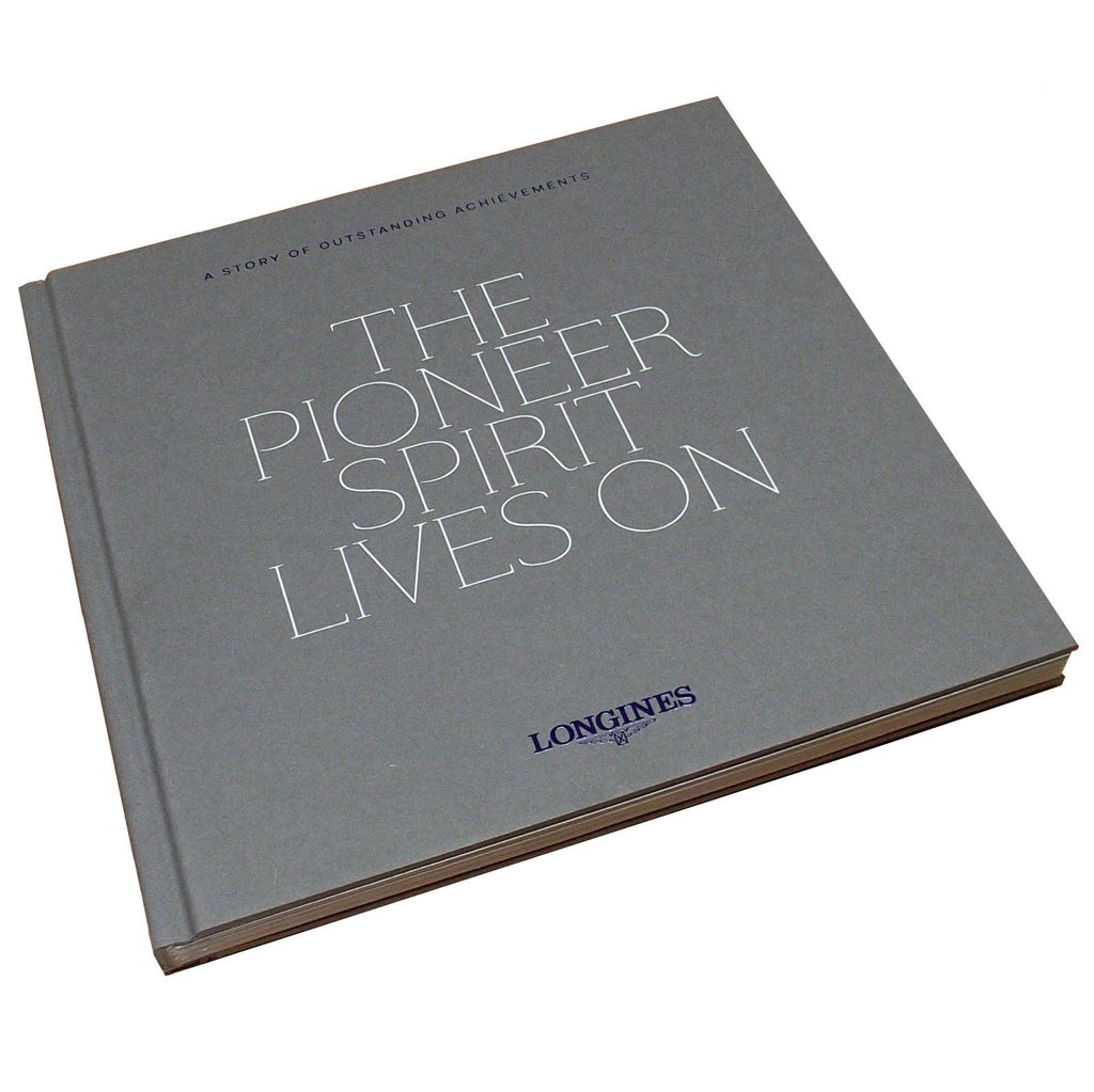 Libretto grigio con scritta THE PIONEER SPIRIT EDITION e logo LONGINES