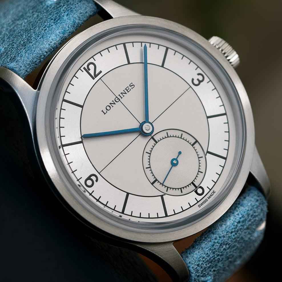 Orologio Longines con quadrante argento e piccoli secondi, cassa acciaio e cinturino pelle blu