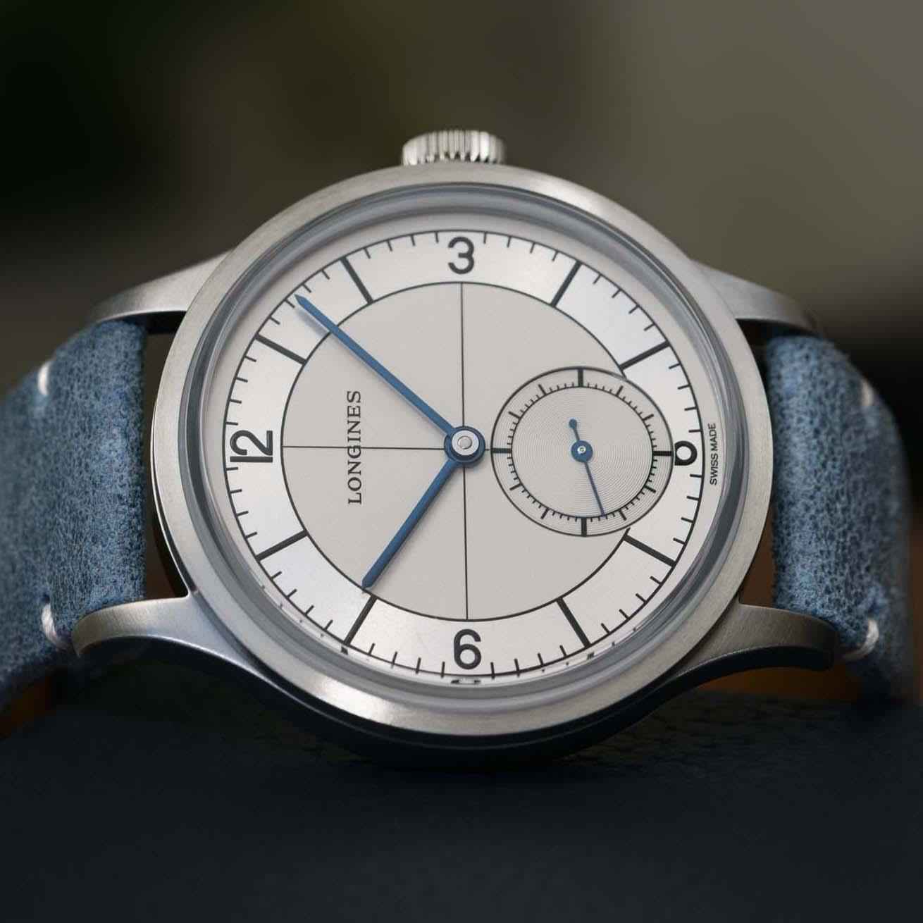 Orologio Longines con quadrante argento e piccoli secondi, lancette blu, cassa acciaio, pelle blu