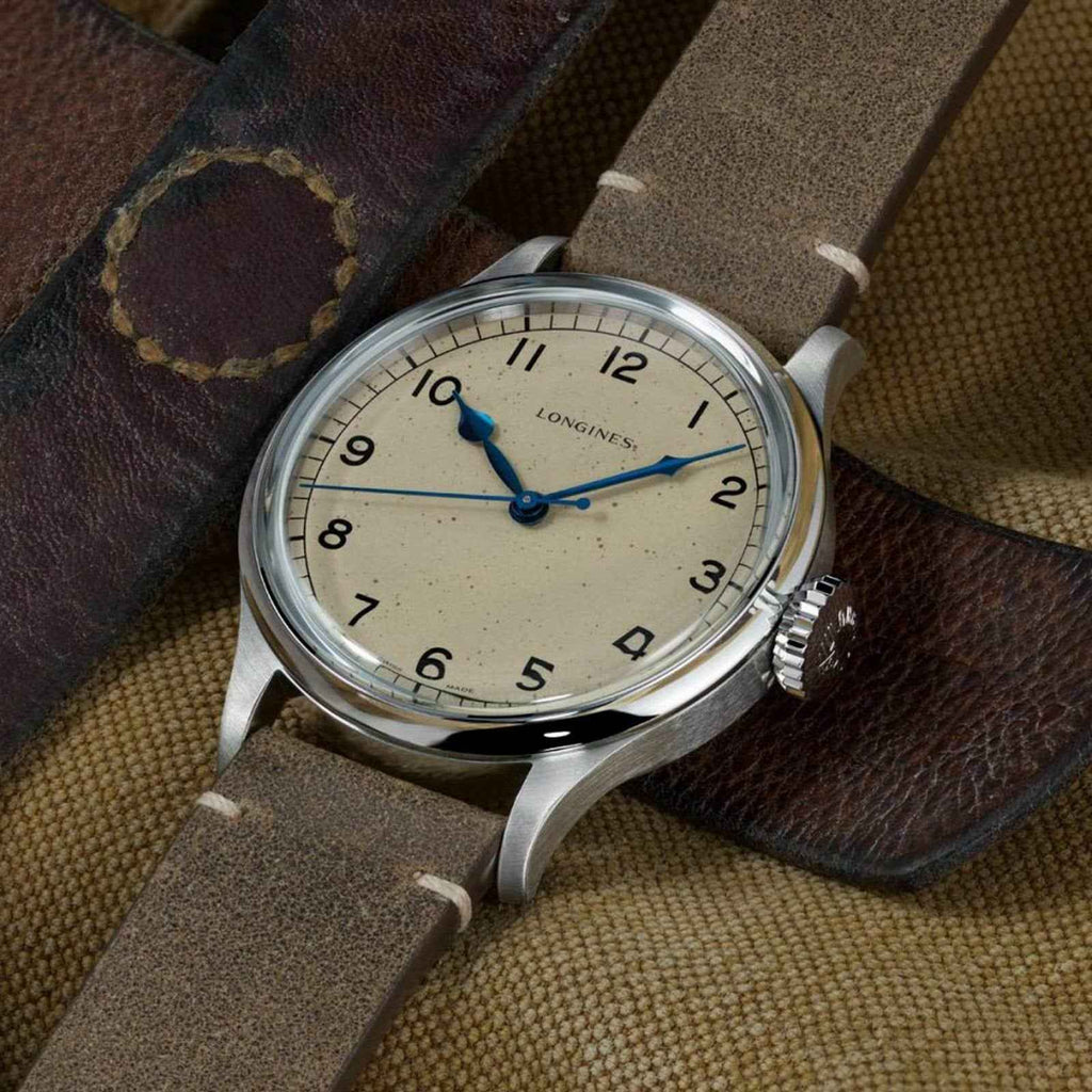 Orologio Longines con quadrante crema e cinturino in pelle marrone, cassa acciaio