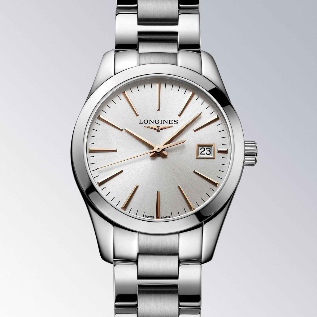 Orologio Longines in acciaio con quadrante bianco, indici a bastone e datario