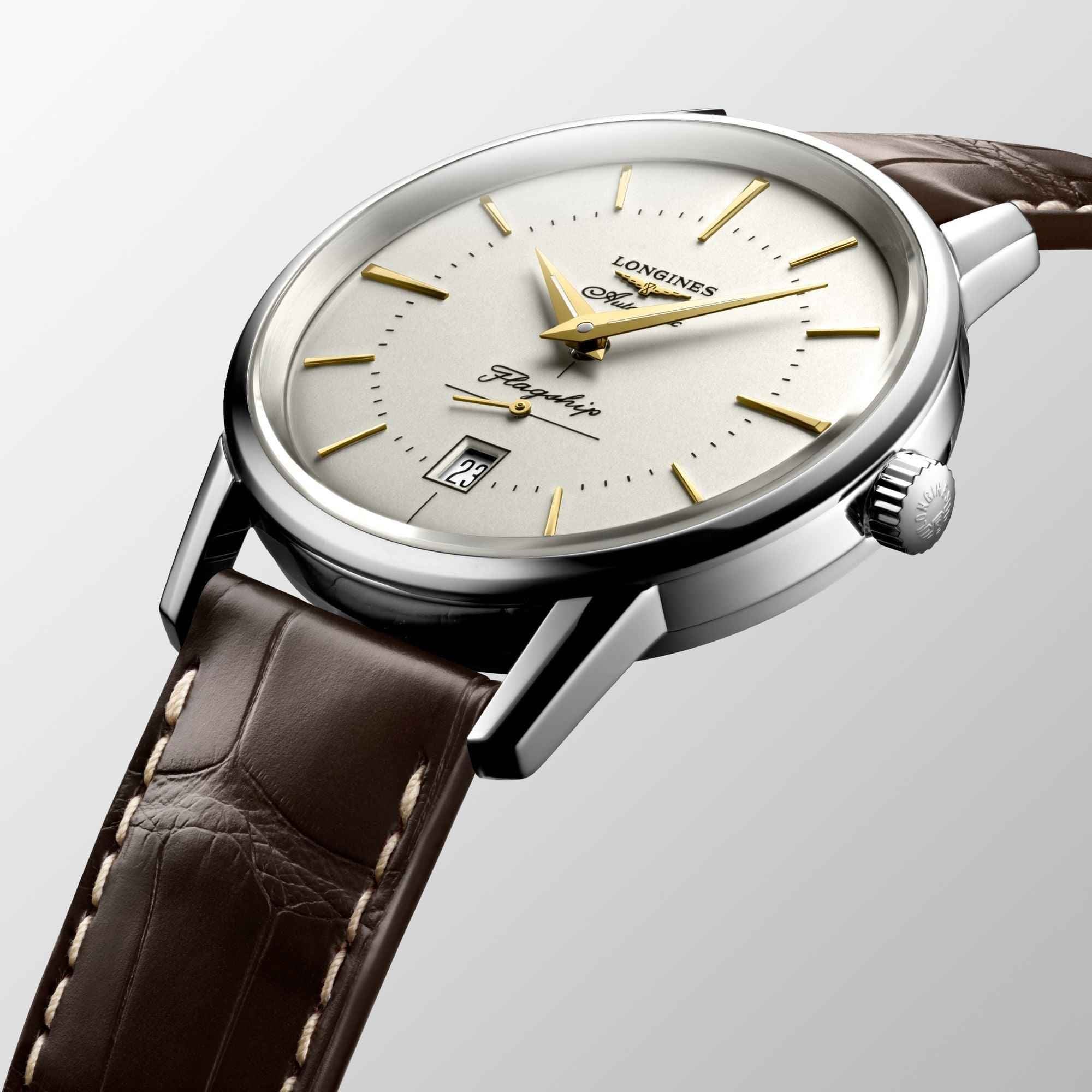 Orologio Longines con quadrante crema e lancette dorate, cinturino in pelle marrone