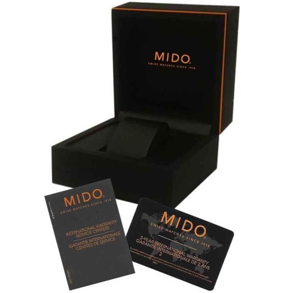 Scatola e carte MIDO con confezione nera e dettagli arancioni