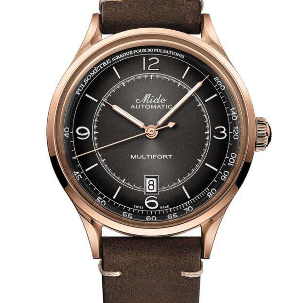 Orologio automatico frontale: quadrante nero, cassa rosé e cinturino in pelle marrone.