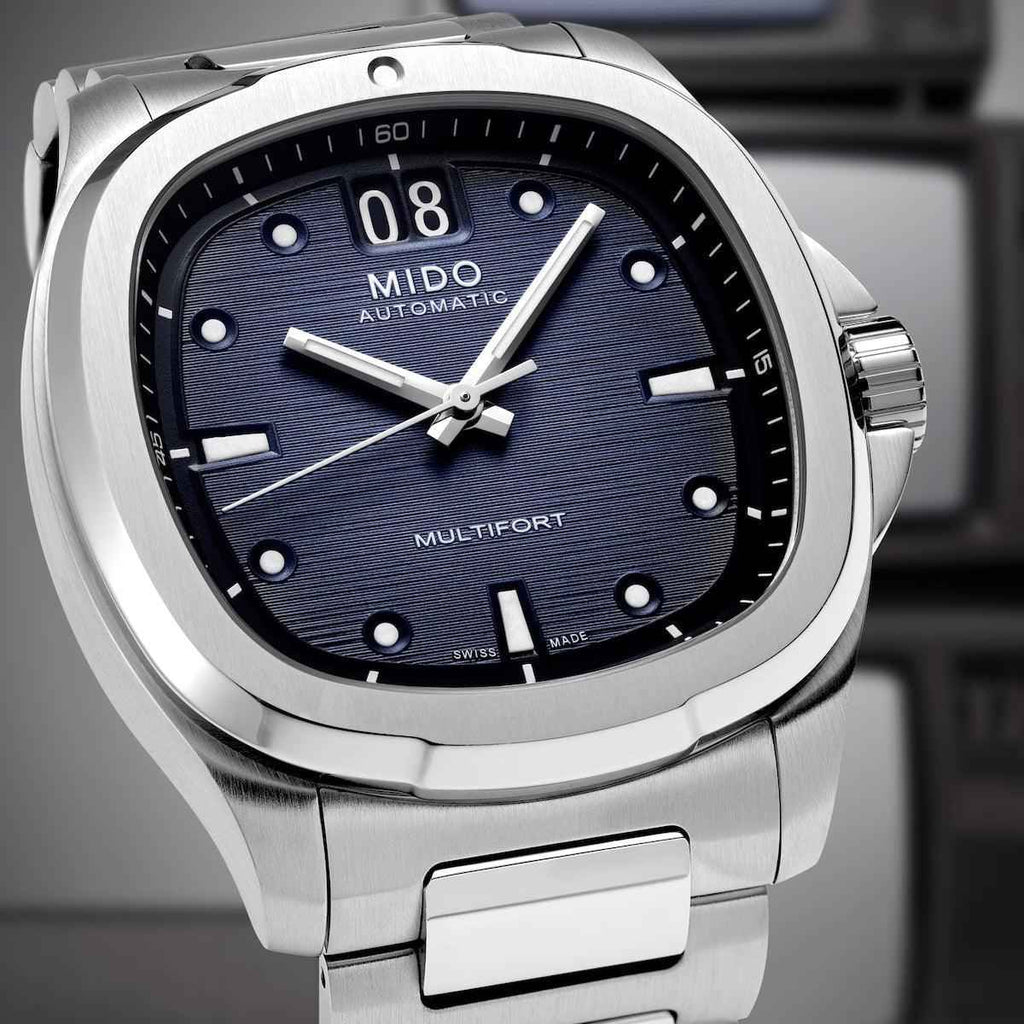 Orologio Mido con quadrante blu e indici neri, lancette bianche e finestra 08