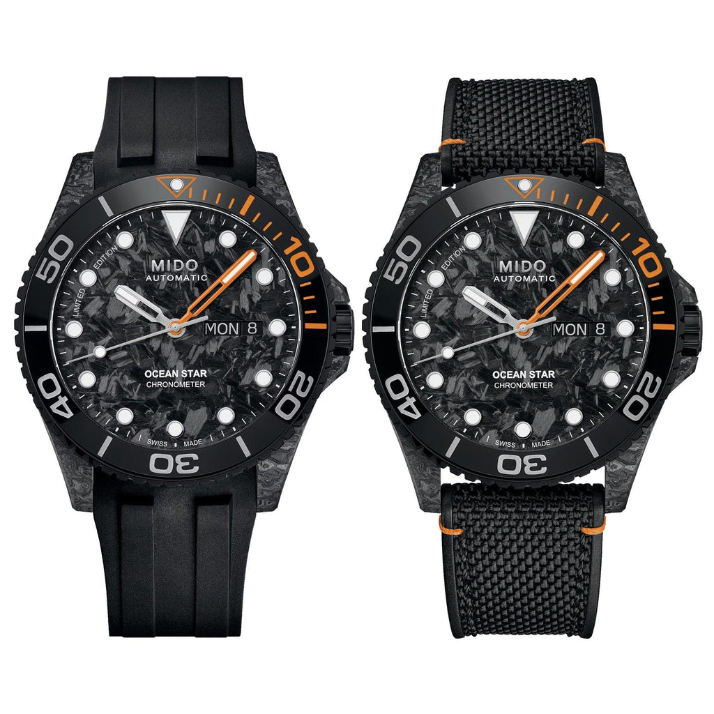 Orologio nero con lunetta e indici arancioni, quadrante carbonio, cinturino in tessuto nero