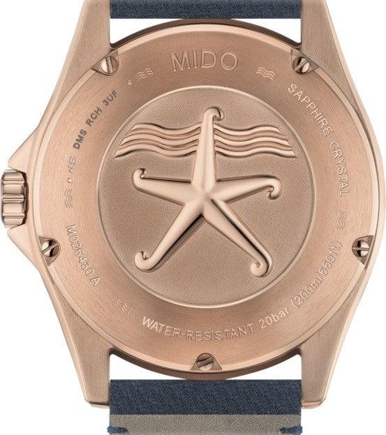Orologio Mido con fondello in acciaio PVD rosa e incisione stella marina, cinturino blu