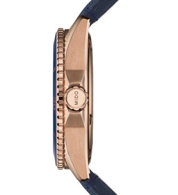 Orologio Mido Ocean Star vista laterale: cassa PVD rosa, corona e cinturino blu