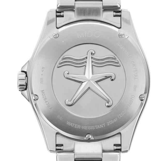 Fondello orologio Mido in acciaio con simbolo stella e scritte WATER-RESISTANT